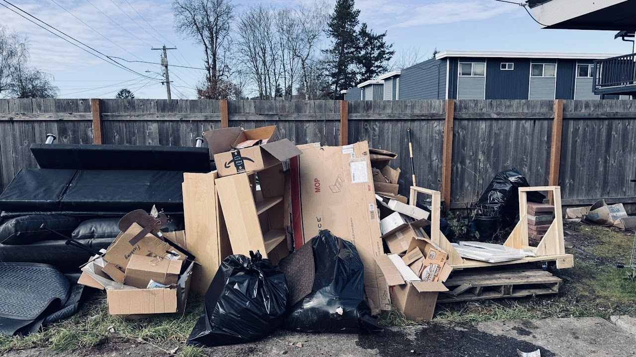 A pile of household junk and boxes ready to be hauled away